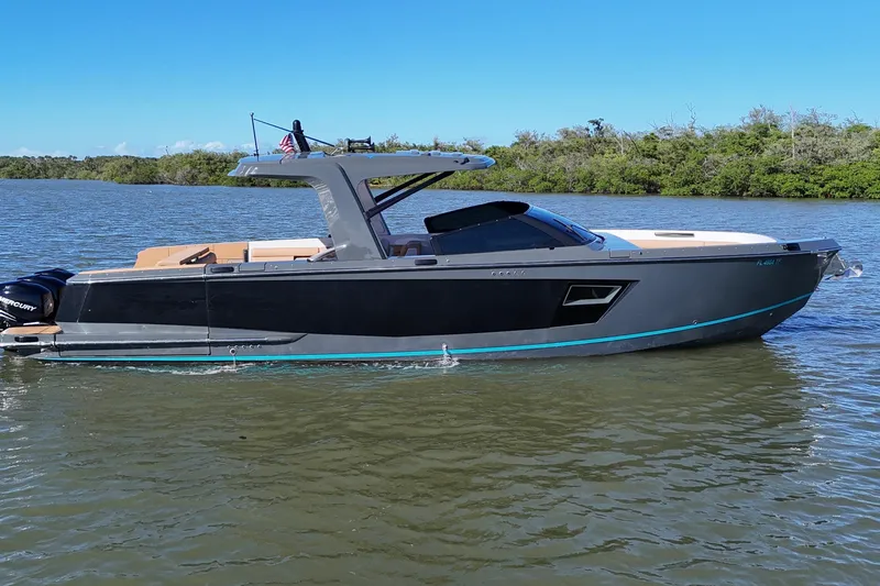  Yacht Photos Pics 2022 Aviara AV40 OB boat on calm water, sleek design, modern features, and scenic backdrop.