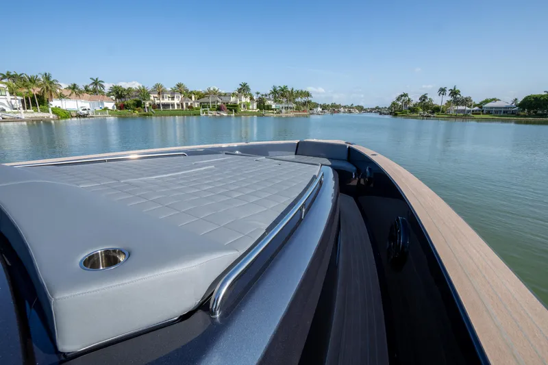  Yacht Photos Pics Luxurious 2025 Pardo Yachts 50 cruising on a serene waterway, featuring sleek deck design.