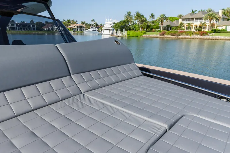  Yacht Photos Pics Luxurious seating on 2025 Pardo Yachts 50, overlooking serene waterfront homes.