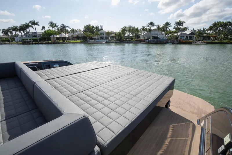  Yacht Photos Pics Luxurious 2025 Pardo Yachts 50 with spacious sunbed overlooking serene waterfront homes.