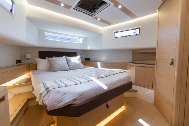  Yacht Photos Pics Luxurious cabin interior of 2025 Pardo Yachts 50, featuring modern design and cozy bedding.