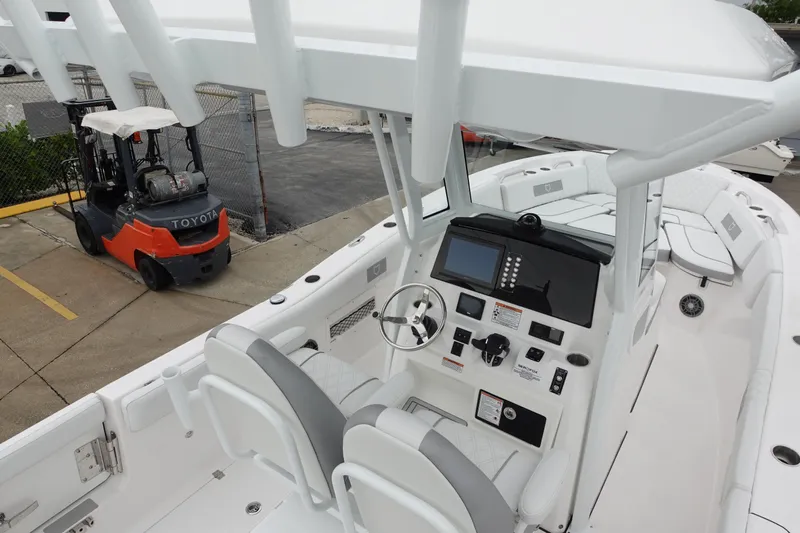  Yacht Photos Pics 2025 Sea Fox 268 Commander boat interior with modern controls, docked near a forklift.