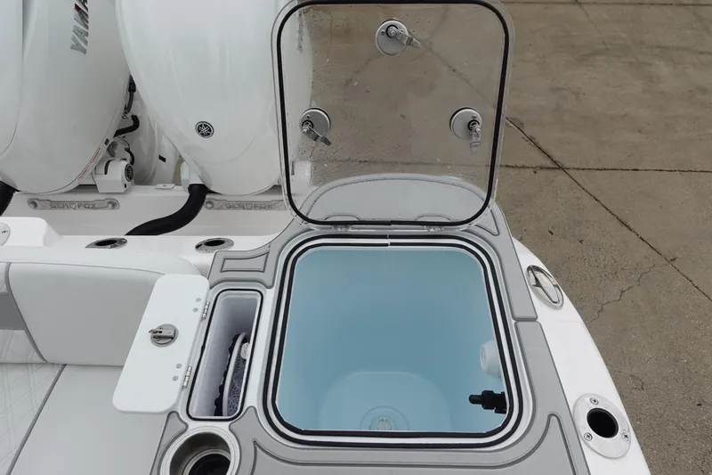  Yacht Photos Pics 2025 Sea Fox 268 Commander boat with open storage compartment and dual engines.