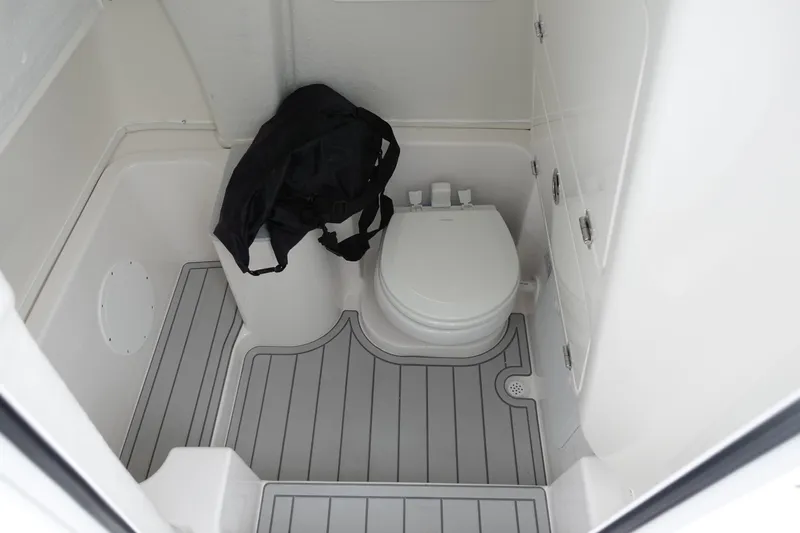  Yacht Photos Pics 2025 Sea Fox 268 Commander boat interior with toilet and storage area.