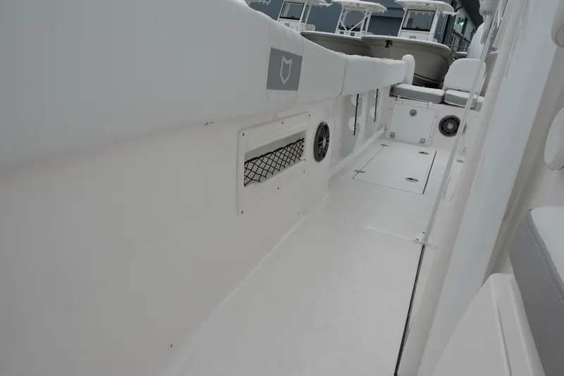  Yacht Photos Pics 2025 Sea Fox 268 Commander boat interior with sleek white design and storage features.