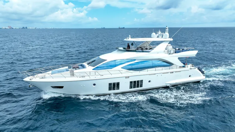 Satisfaction Yacht Photos Pics 2017 Azimut 84 Flybridge yacht cruising on open sea under blue sky.