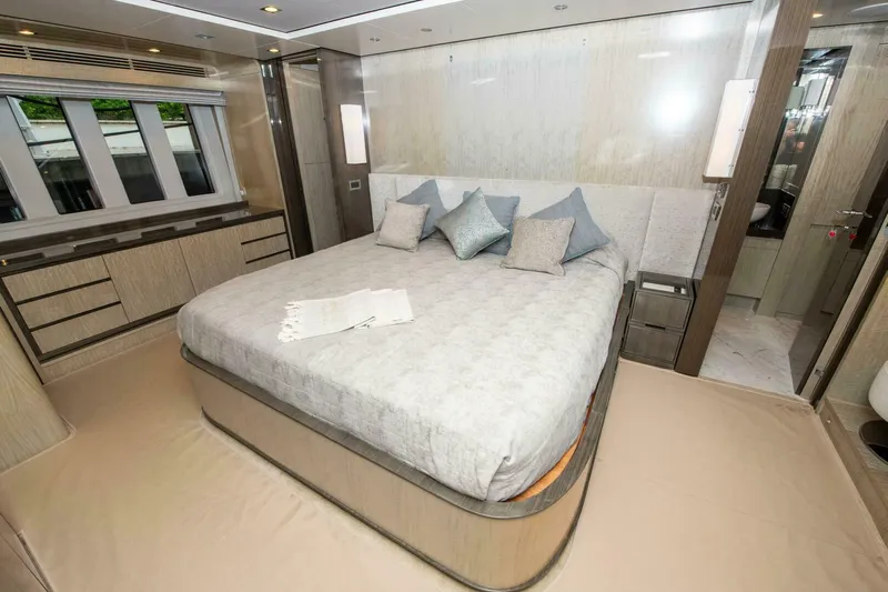 Satisfaction Yacht Photos Pics Luxurious bedroom interior of 2017 Azimut 84 Flybridge yacht with elegant bedding and decor.