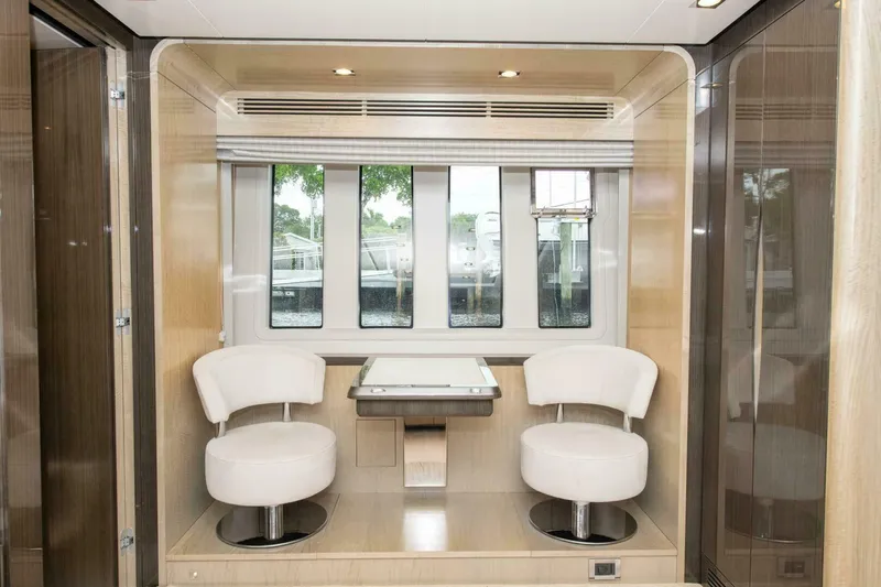 Satisfaction Yacht Photos Pics Luxurious interior of 2017 Azimut 84 Flybridge yacht with modern seating and windows.