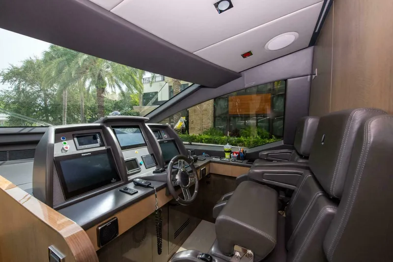 Satisfaction Yacht Photos Pics Luxurious 2017 Azimut 84 Flybridge yacht cockpit with modern navigation equipment and plush seating.