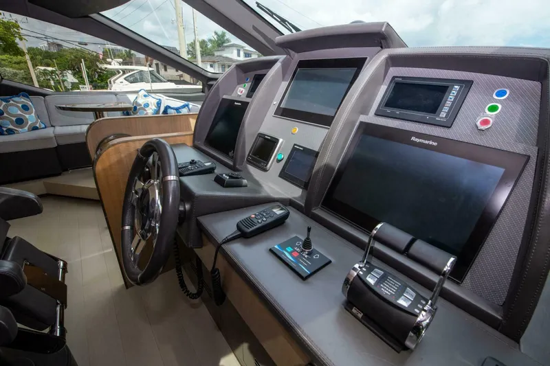 Satisfaction Yacht Photos Pics Luxurious helm of 2017 Azimut 84 Flybridge yacht with advanced navigation systems.