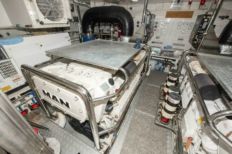 Satisfaction Yacht Photos Pics Engine room of 2017 Azimut 84 Flybridge yacht, featuring MAN engines and control panels.