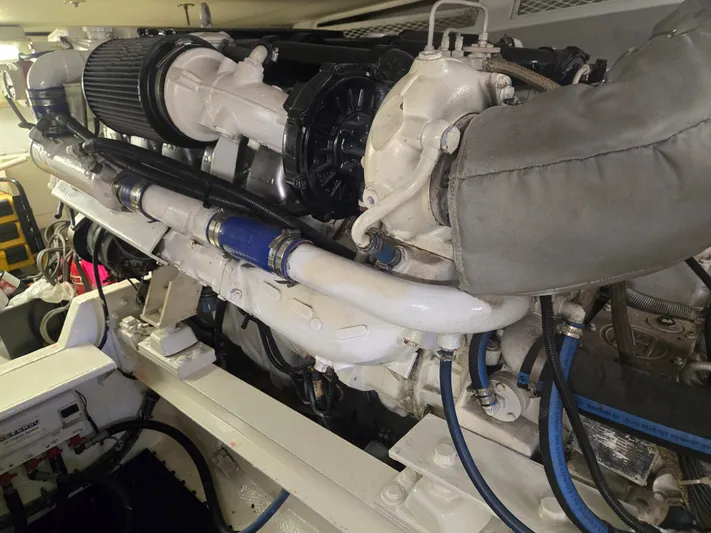 Lay A Wake Yacht Photos Pics Engine room of a 1990 Viking 53 Convertible yacht, showcasing detailed mechanical components.