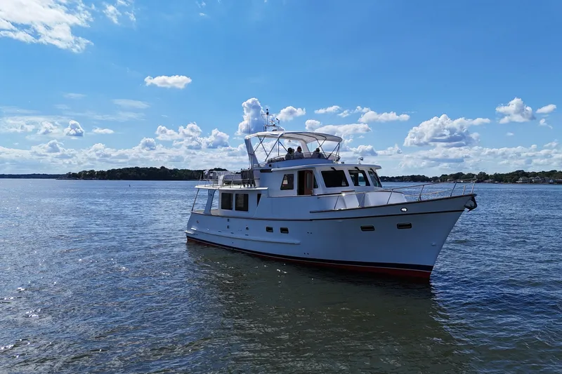 Marjorie Ann Yacht Photos Pics 2006 DeFever 52 Euro yacht cruising on a sunny day with blue skies.