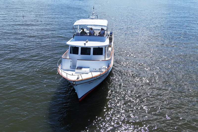 Marjorie Ann Yacht Photos Pics 2006 DeFever 52 Euro yacht cruising on open water, viewed from the front.