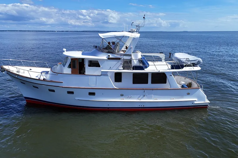 Marjorie Ann Yacht Photos Pics 2006 DeFever 52 Euro yacht cruising on calm blue waters under a clear sky.