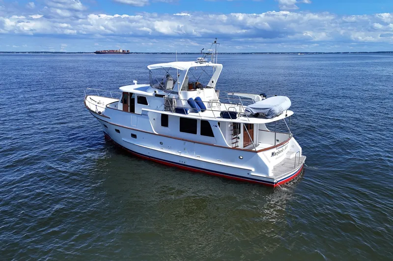 Marjorie Ann Yacht Photos Pics 2006 DeFever 52 Euro yacht on calm ocean waters under a blue sky.