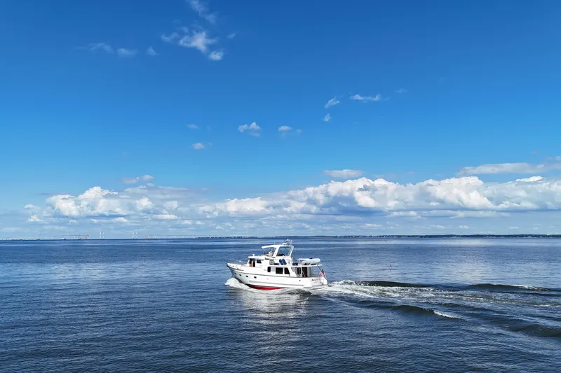 Marjorie Ann Yacht Photos Pics 2006 DeFever 52 Euro yacht cruising on a calm, blue ocean under a clear sky.