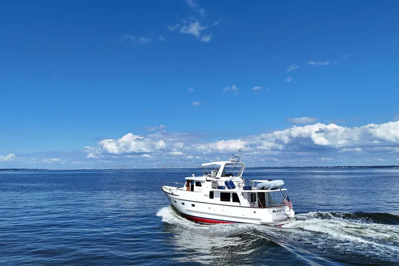 Marjorie Ann Yacht Photos Pics 2006 DeFever 52 Euro yacht cruising on open water under a clear blue sky.