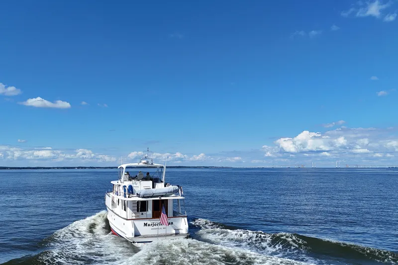 Marjorie Ann Yacht Photos Pics DeFever 52 Euro yacht cruising on open water under clear blue skies, 2006 model.