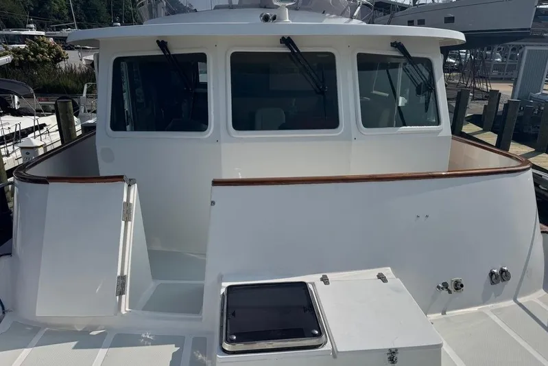 Marjorie Ann Yacht Photos Pics 2006 DeFever 52 Euro yacht, featuring a spacious deck and sleek design.