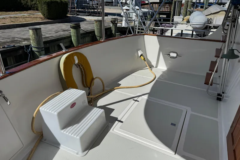 Marjorie Ann Yacht Photos Pics 2006 DeFever 52 Euro yacht deck with steps, life ring, and dockside power connection.