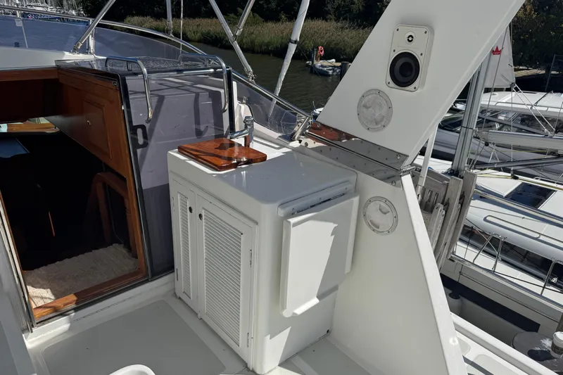 Marjorie Ann Yacht Photos Pics 2006 DeFever 52 Euro yacht deck with outdoor sink and storage cabinet.