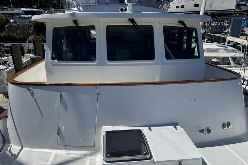 Marjorie Ann Yacht Photos Pics 2006 DeFever 52 Euro yacht, white exterior, docked at marina.