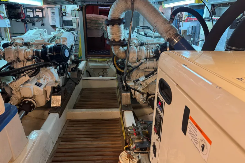 Marjorie Ann Yacht Photos Pics Engine room of 2006 DeFever 52 Euro yacht, showcasing dual engines and mechanical systems.