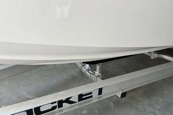  Yacht Photos Pics 2025 Concept 27' Open Deck boat on a Rocket trailer in a garage.