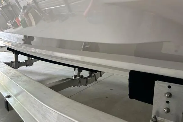  Yacht Photos Pics 2025 Concept 27' Open Deck boat on trailer, close-up view of hull and support.