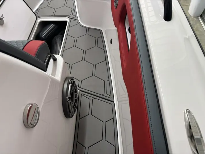  Yacht Photos Pics Interior of 2025 Concept 27' Open Deck boat with hexagonal flooring and red accents.