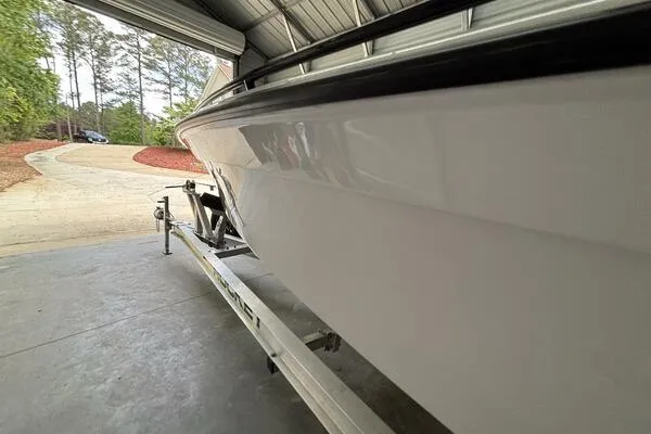  Yacht Photos Pics 2025 Concept 27' Open Deck boat on trailer in garage setting.