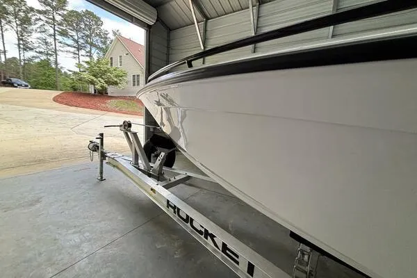  Yacht Photos Pics 2025 Concept 27' Open Deck boat on trailer in garage setting.