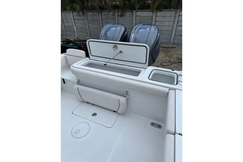  Yacht Photos Pics 2023 Sea Hunt Gamefish 27 boat with open storage compartment and dual engines.