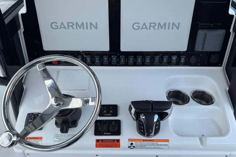  Yacht Photos Pics 2023 Sea Hunt Gamefish 27 console with Garmin displays and steering wheel.
