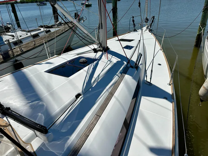 Celtic Rose Yacht Photos Pics 2018 Jeanneau Sun Odyssey 419 sailboat docked, showcasing sleek deck design and rigging.