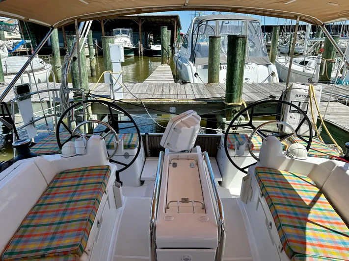Celtic Rose Yacht Photos Pics 2018 Jeanneau Sun Odyssey 419 sailboat cockpit with dual steering wheels and colorful seating.