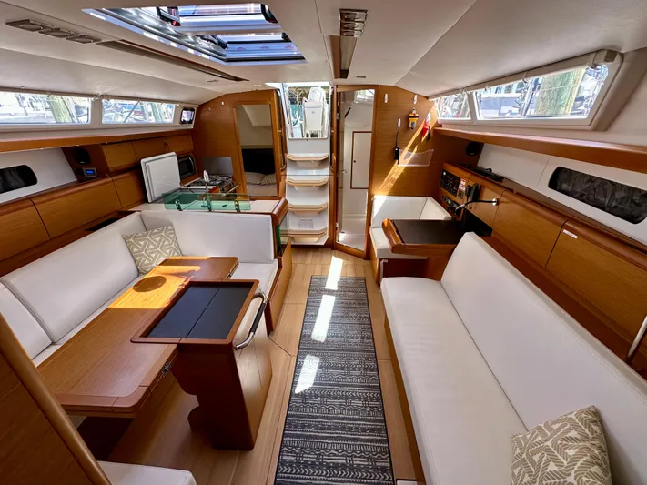 Celtic Rose Yacht Photos Pics 2018 Jeanneau Sun Odyssey 419 interior with elegant wood finish and spacious seating.