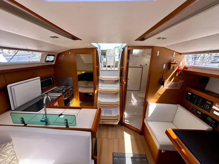 Celtic Rose Yacht Photos Pics Interior of 2018 Jeanneau Sun Odyssey 419 sailboat, featuring modern design and cozy seating.