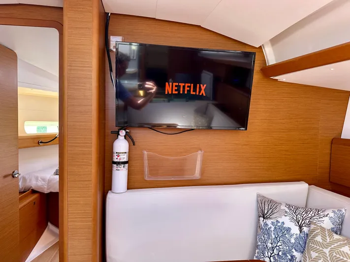 Celtic Rose Yacht Photos Pics Interior of 2018 Jeanneau Sun Odyssey 419 yacht with TV displaying Netflix.
