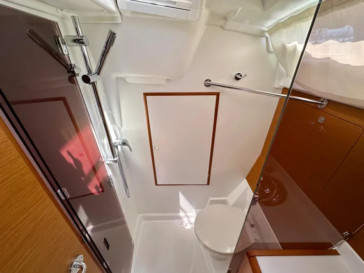 Celtic Rose Yacht Photos Pics Bathroom interior of 2018 Jeanneau Sun Odyssey 419 yacht, featuring modern fixtures and wood accents.
