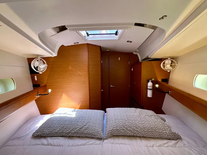Celtic Rose Yacht Photos Pics 2018 Jeanneau Sun Odyssey 419 cabin interior with skylight and cozy bedding.