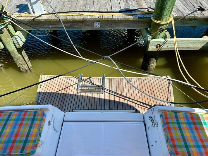 Celtic Rose Yacht Photos Pics Jeanneau Sun Odyssey 419, 2018, docked with colorful seating, wooden pier, and mooring lines.