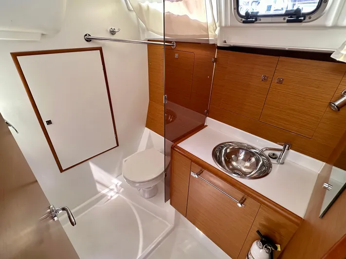 Celtic Rose Yacht Photos Pics 2018 Jeanneau Sun Odyssey 419 bathroom with modern fixtures and wooden cabinetry.