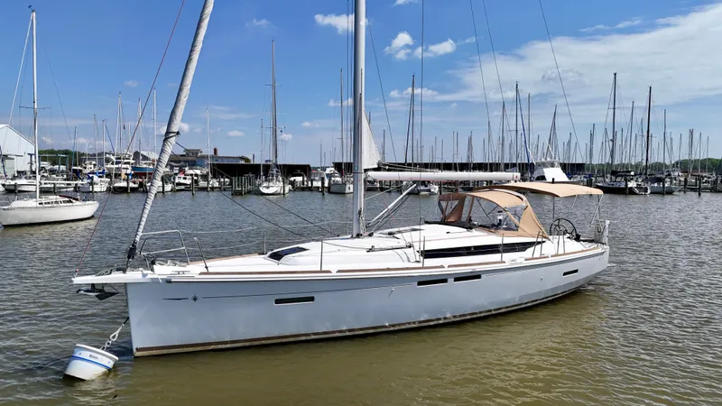 Celtic Rose Yacht Photos Pics 2018 Jeanneau Sun Odyssey 419 sailboat docked in a marina under a clear blue sky.