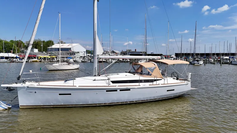 Celtic Rose Yacht Photos Pics 2018 Jeanneau Sun Odyssey 419 sailboat docked in a marina under a clear blue sky.