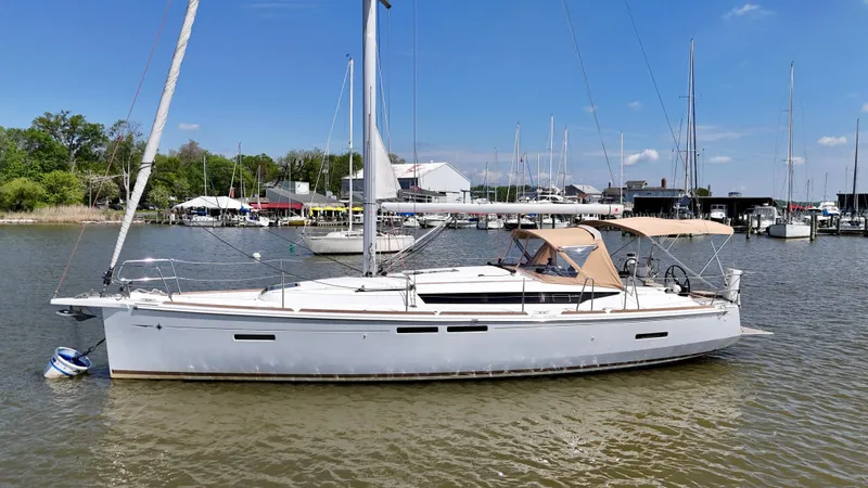 Celtic Rose Yacht Photos Pics 2018 Jeanneau Sun Odyssey 419 sailboat docked in a marina under clear blue skies.