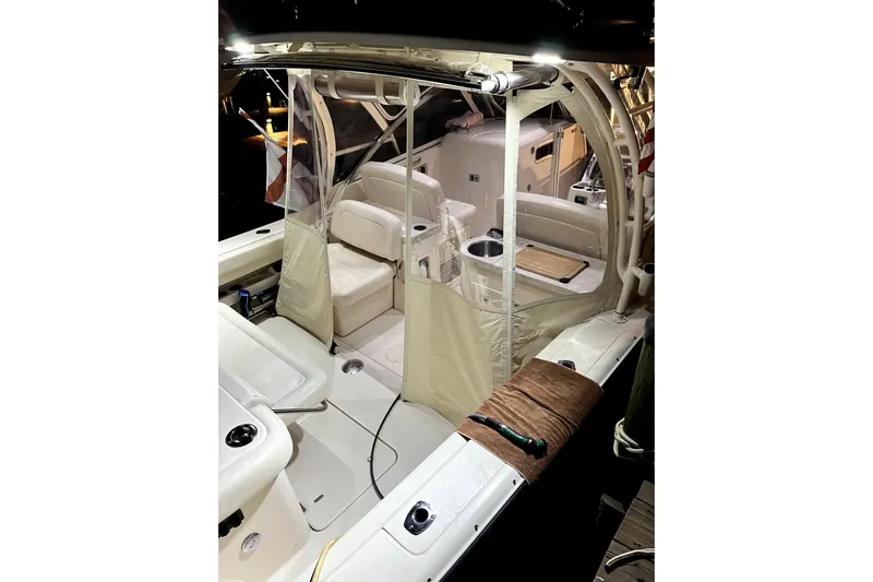 Liquid Carr-ma Yacht Photos Pics 2017 Grady-White Freedom 307 boat interior with seating and protective covers.