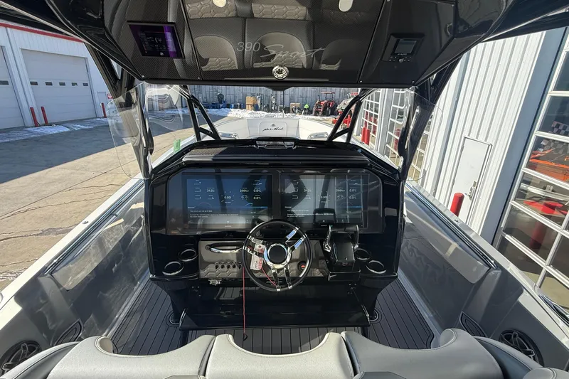  Yacht Photos Pics 2023 Nor-Tech 390 Sport Center Console helm with advanced navigation displays and controls.