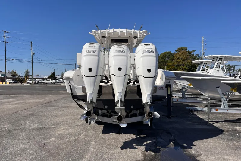  Yacht Photos Pics 2019 Fountain 38 Center Console with triple 350 horsepower engines, parked outdoors.